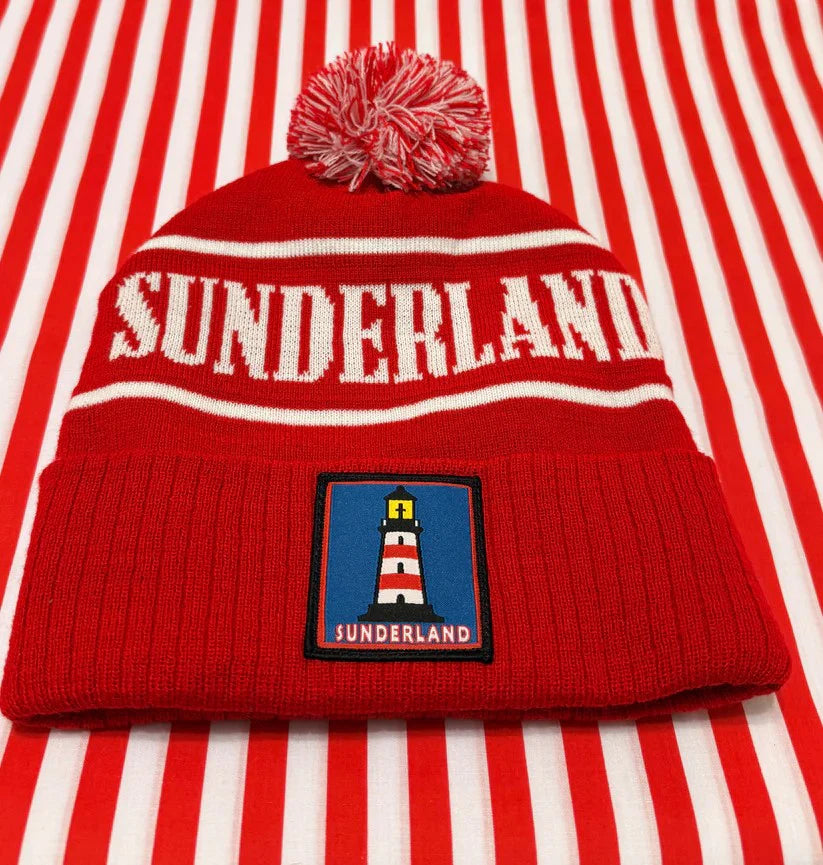 Red beanie with 'Sunderland' text and logo on a red and white striped background