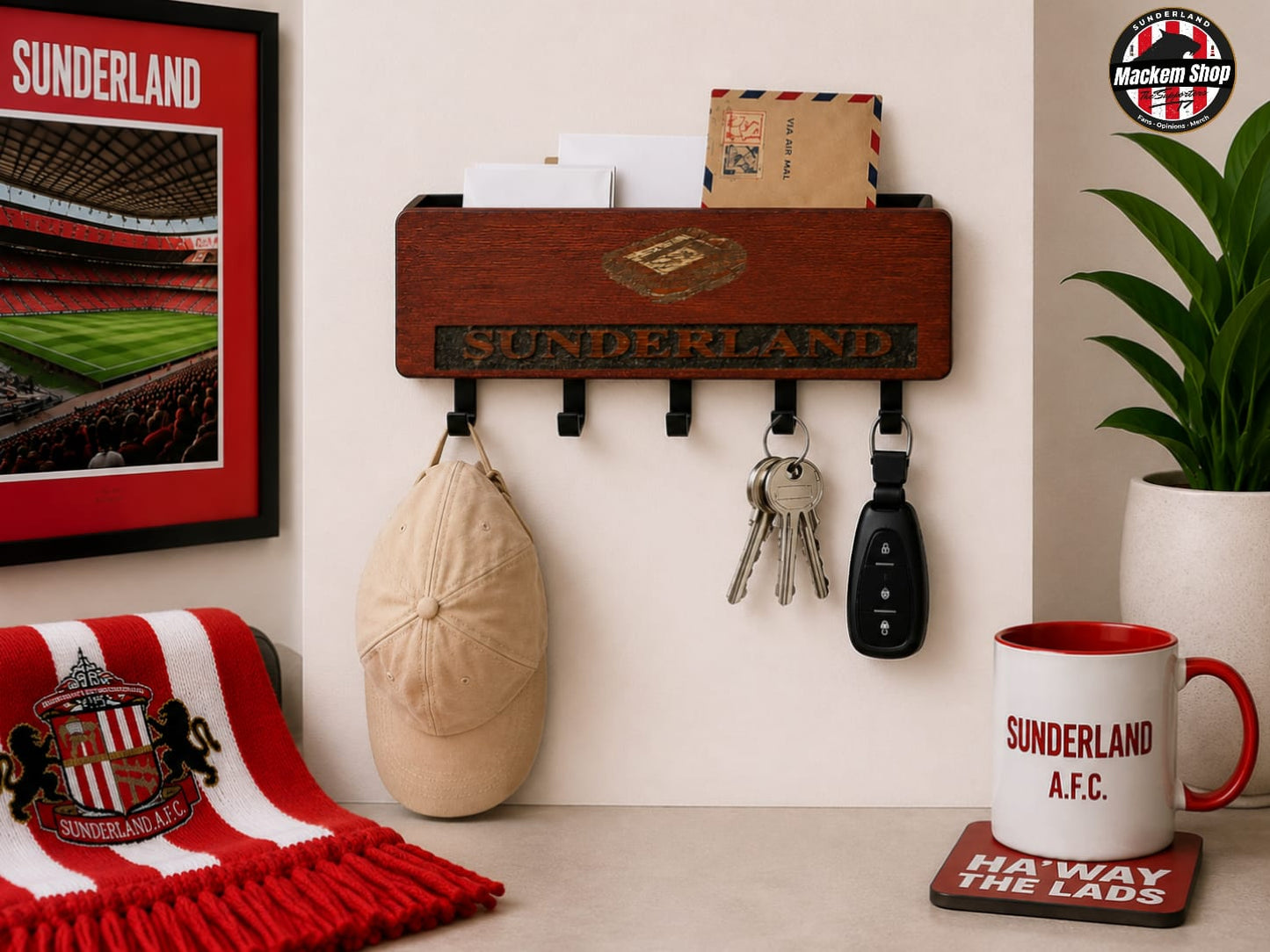 A wooden wall-mounted key holder and mail slot organizer with 'SUNDERLAND' lettering, shown in a styled room setting with a Sunderland A.F.