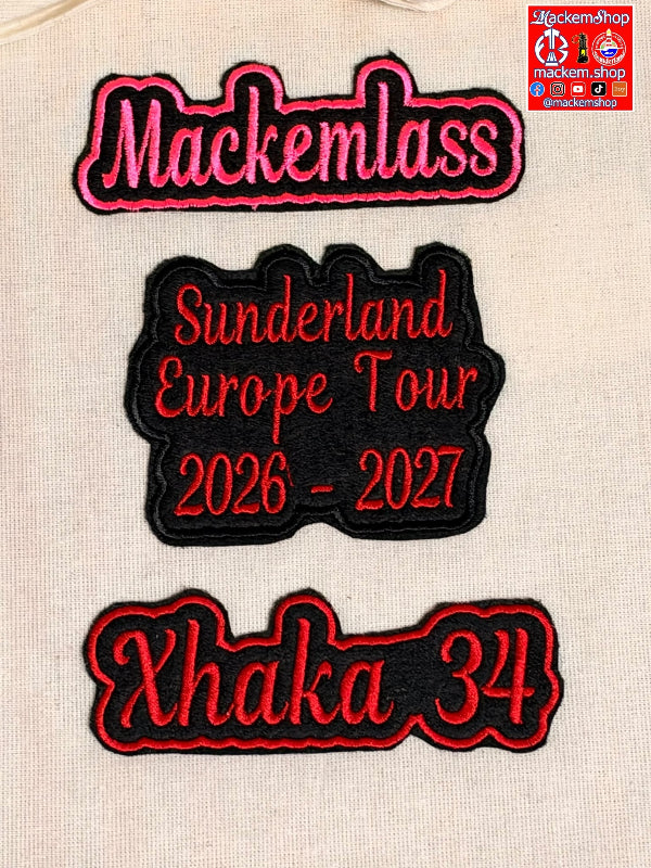 Three embroidered patches displayed on a beige fabric background. The top patch reads 'Mackemlass' in pink with black and white outlining. The Second patch reads 'Sunderland European Tour 2026-27' in red with black outlining and the third patch reads 'Xhaka 34' in red on a black patch. A MackemShop logo is visible on top right corner.