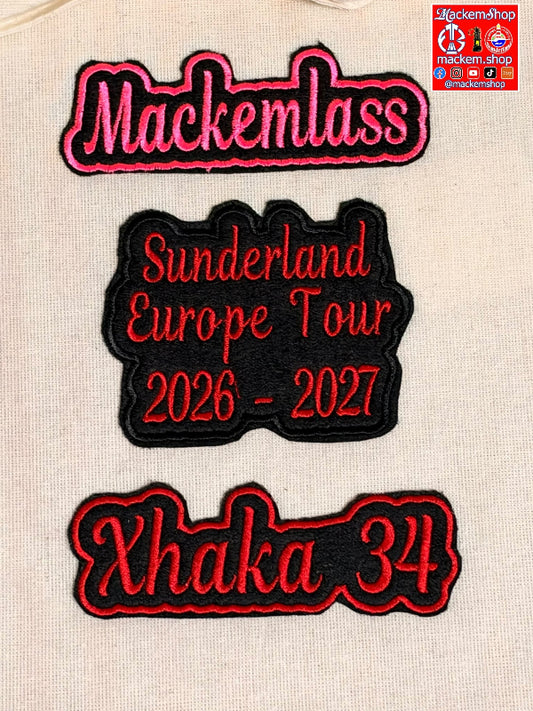 Three embroidered patches displayed on a beige fabric background. The top patch reads 'Mackemlass' in pink with black and white outlining. The Second patch reads 'Sunderland European Tour 2026-27' in red with black outlining and the third patch reads 'Xhaka 34' in red on a black patch. A MackemShop logo is visible on top right corner.