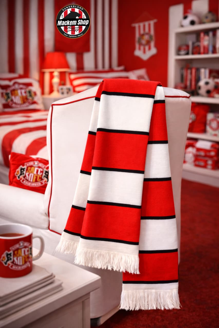 Red and white striped blanket draped over a chair in a room with sports-themed decor.