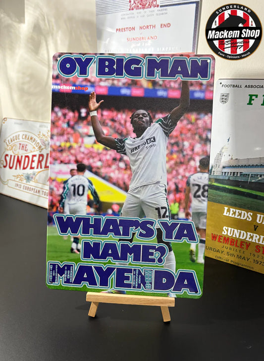 Soccer-themed poster with a player on a stand, surrounded by sports memorabilia.