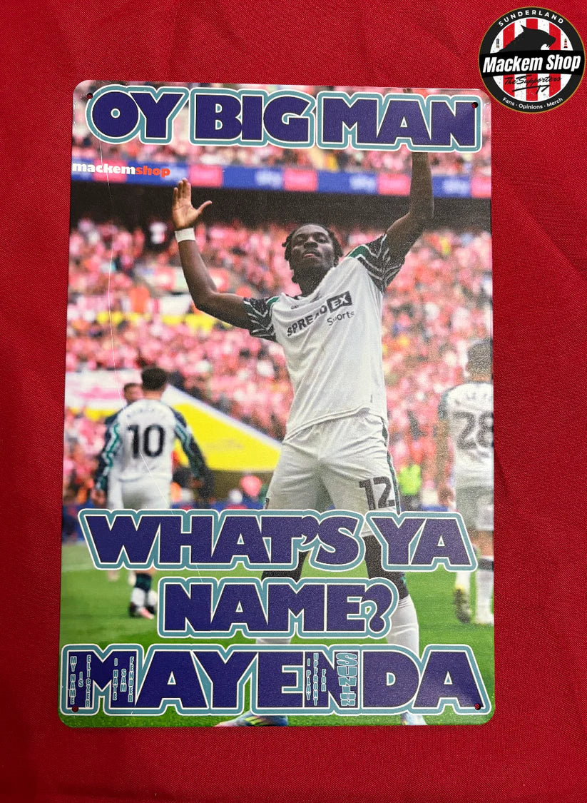 Soccer player on a magazine cover with text 'Oy Big Man, What's Ya Name? Mayenda' on a red background.