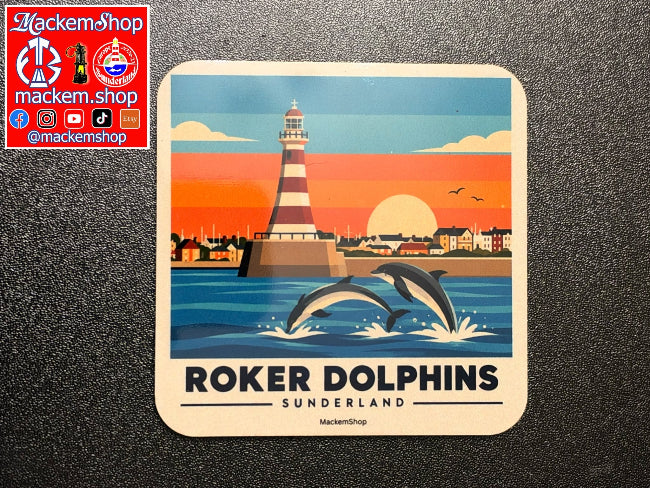 A Roker coaster featuring a retro-style illustration of the Roker Dolphins in Sunderland, with two dolphins jumping in front of a lighthouse at sunset. The coaster is placed on a dark textured surface, with a red MackemShop logo overlay in the top-left corner.