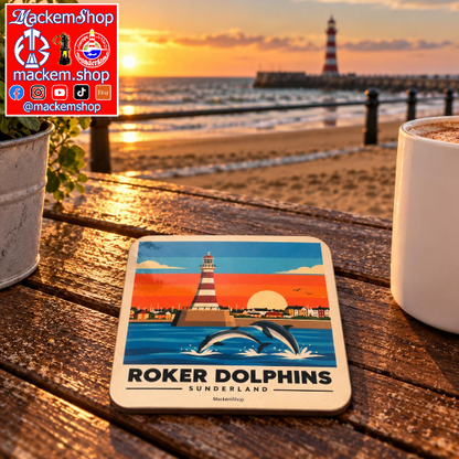 Roker Dolphins Sunderland coaster by MackemShop displayed on a rustic wooden table at sunset, with Roker Beach, the sea, and Roker Lighthouse in the background. A MackemShop Logo is visible on the Top left corner.