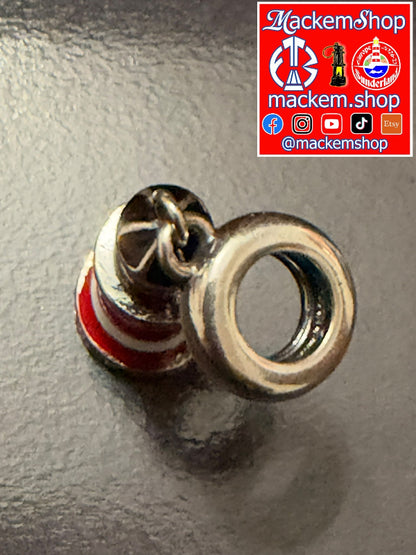 A silver-toned Roker lighthouse charm with red and white striped cylindrical accent and a top screw detail, shown on a dark textured surface with a MackemShop logo overlay in the top right corner.
