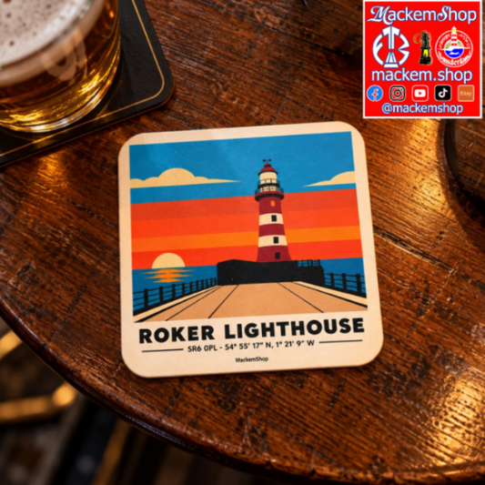 A square coaster featuring a colorful illustration of Roker Lighthouse at sunset, placed on a dark wooden table next to a glass of beer. A red 'Mackemshop' logo is visible in the top right corner.