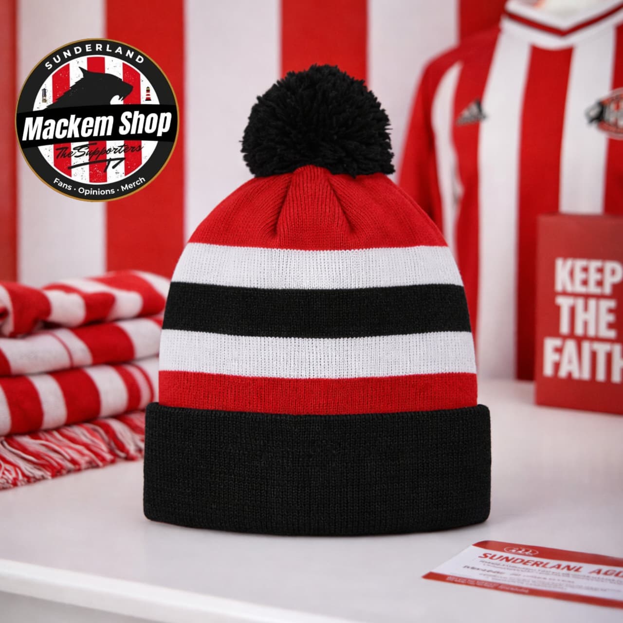 Roker Retro Bobble Hat by Mackem Shop placed on a white table surface 
