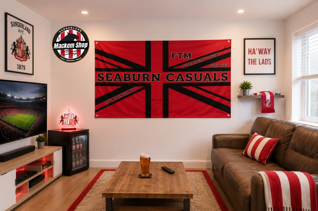 Living room with a large Seaburn Casuals flag on the wall, brown sofa, and TV.