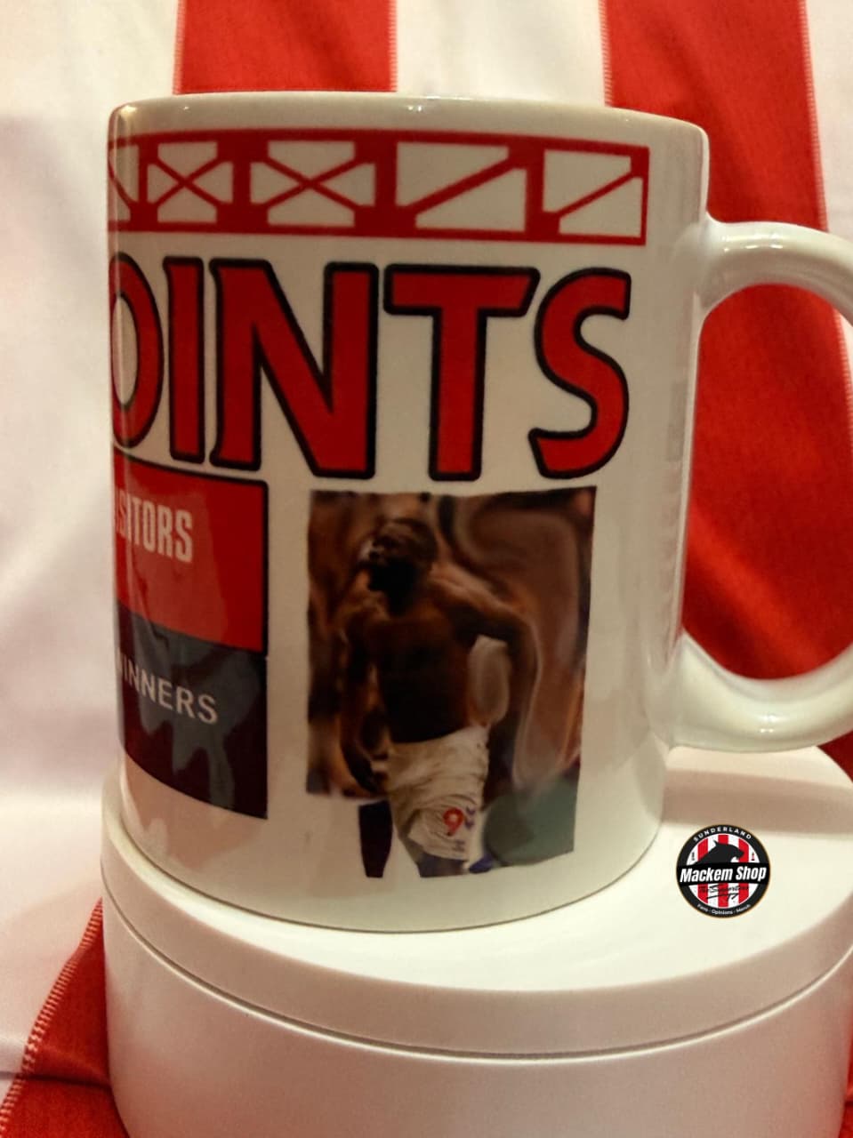 Mug with sports-themed design featuring a photo of Brian brobbey and text on a red and white striped background.
