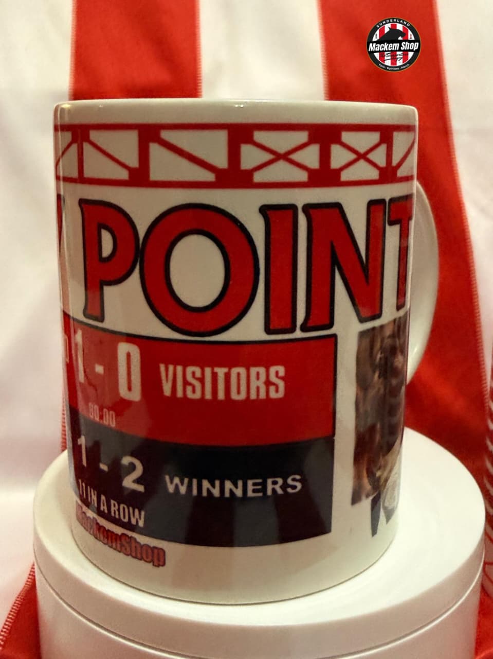 Mug with sports-themed design featuring text and graphics on a white background