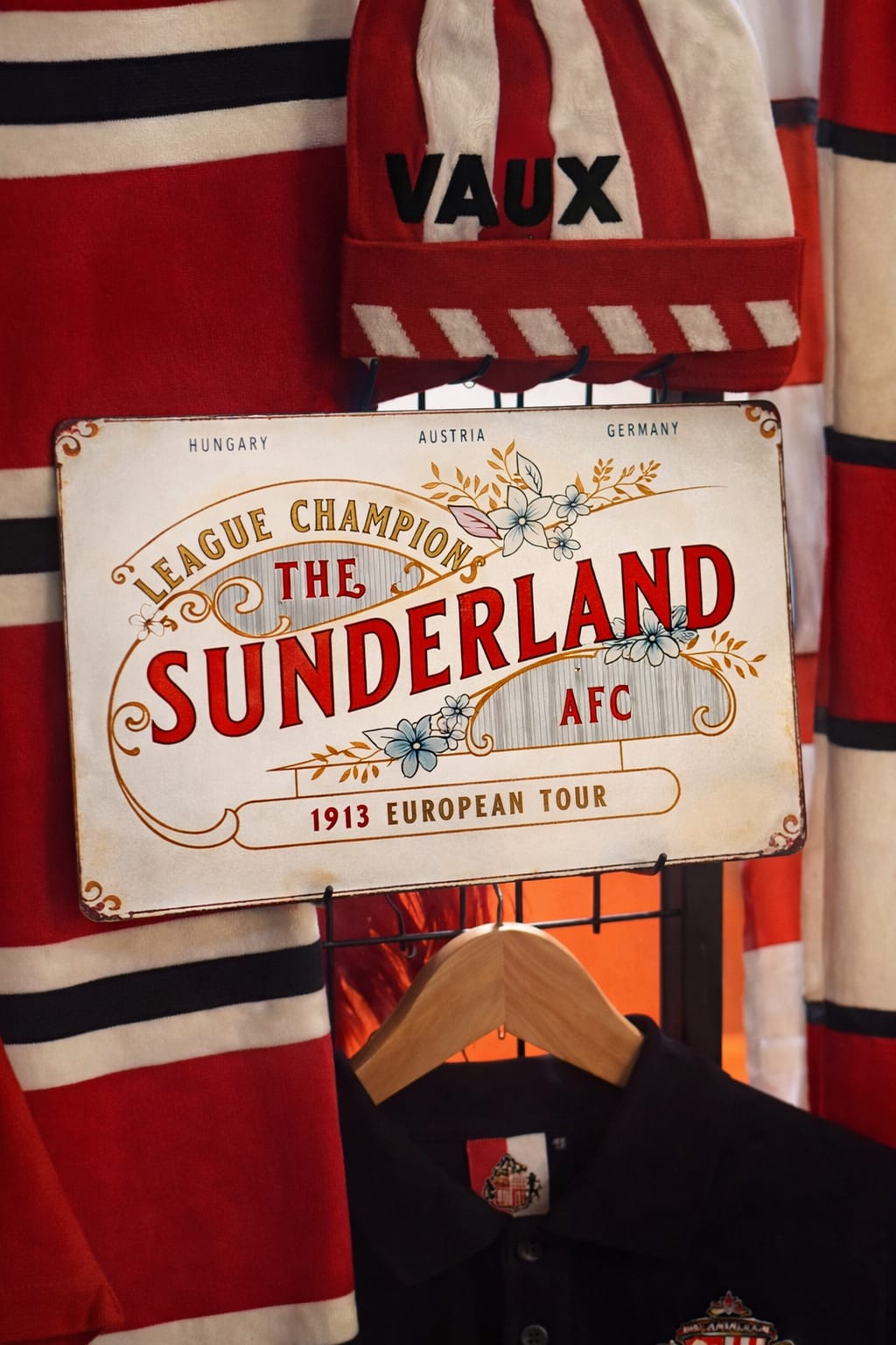 Vintage Sunderland AFC sign with sports equipment in the background