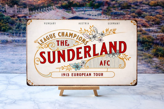 Vintage-style sign for Sunderland AFC with decorative elements on a stand against a blurred natural background.
