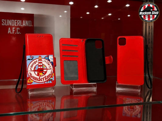 A red folio-style iPhone case set displayed on a glass shelf in a red showroom.