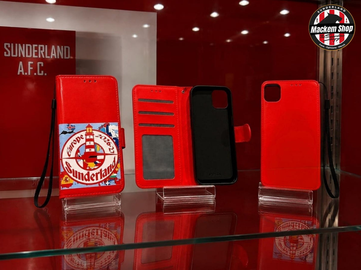 A red folio-style iPhone case set displayed on a glass shelf in a red showroom.