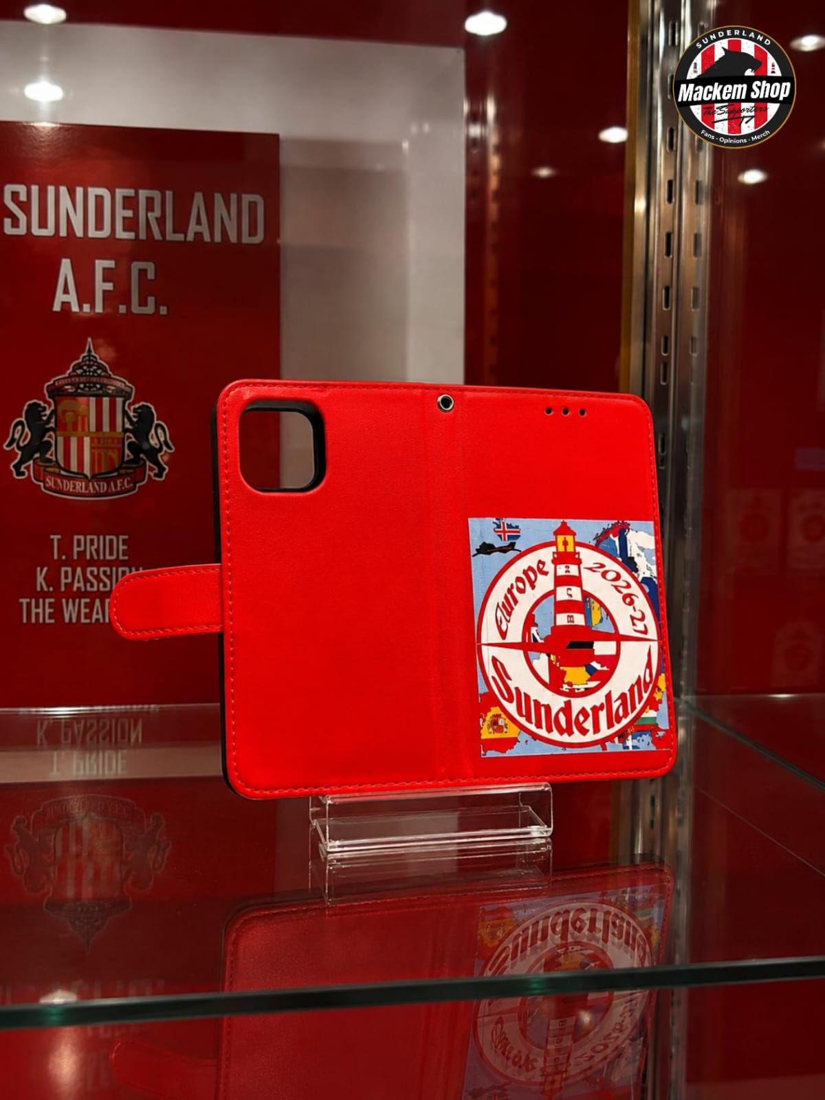 A red iPhone 12/13 mini-Flip cover with Sunderland AFC Europe tour 26-27 patchwork on it.