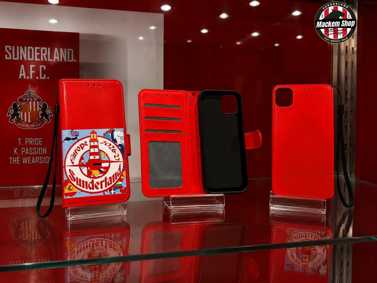 A red iPhone 12/13 mini flip cover on a showcase.