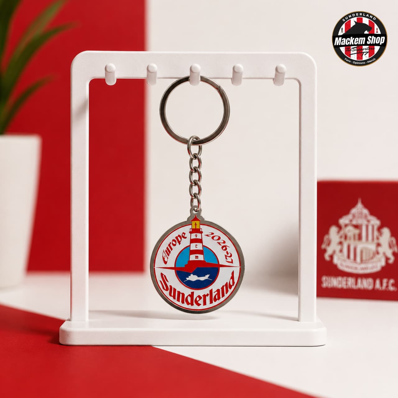 Sunderland keychain on a display stand with a red background
