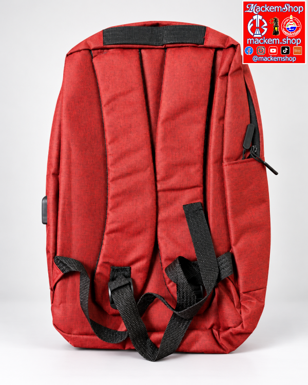 A red backpack shown from the back, featuring padded shoulder straps, a top handle, a side zippered pocket, and a visible USB-C charging port on the side. A 'mackemShop' logo is visible on top right corner.