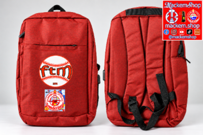 A red backpack shown from the front and back against a light gray studio background. The front features a large baseball graphic with the text 'ftm' and a smaller circular patch below it, with a USB port and a MackemShop logo is visible on top right corner.