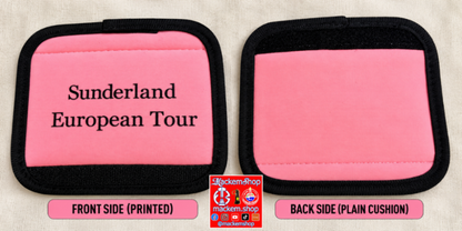 Two pink travel cushion covers with black trim shown side by side on a light fabric background. The left cushion is labeled 'Sunderland European Tour' on the front, and the right cushion shows the plain back side. A MackemShop logo is visible on the middle down part.