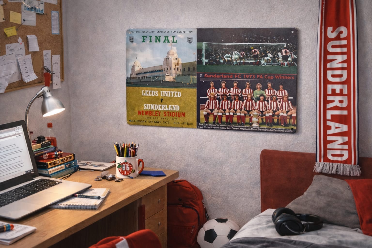 Room interior with a desk, laptop, and a Mackem shop sports memorabilia on the wall.