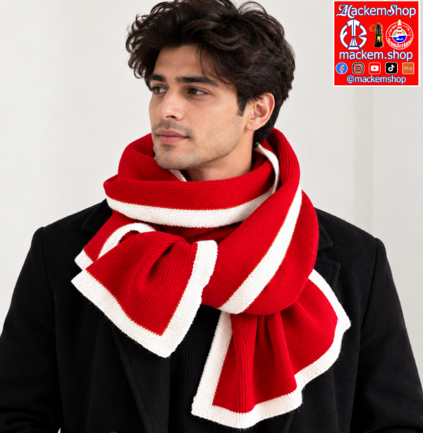 A man wearing a thick ribbed knit scarf in red and white stripes, styled around his neck over a black coat. A 'mackem_shop' logo overlay is visible in the top right corner.