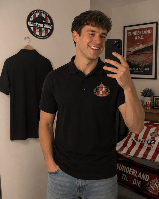 Sunderland Logo Polo wore by a young lad taking selfie in the mirror.