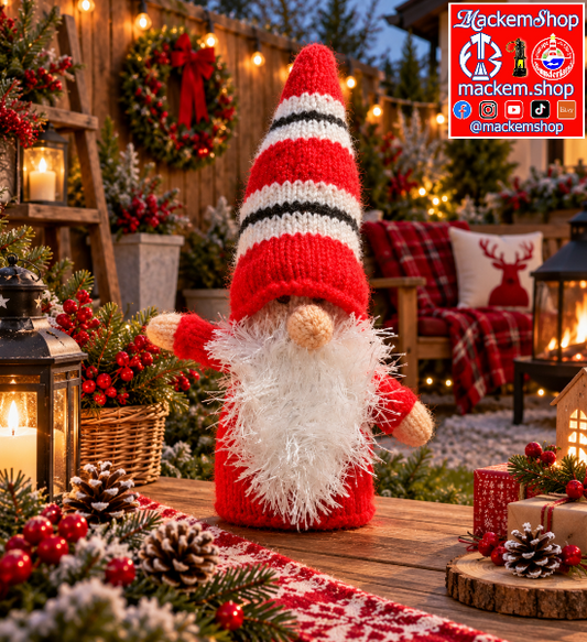 A festive Christmas gnome decoration standing on a wooden table in a decorated outdoor holiday setting. The gnome has a red knit hat with white and black stripes, a fluffy white beard, and red sleeves.