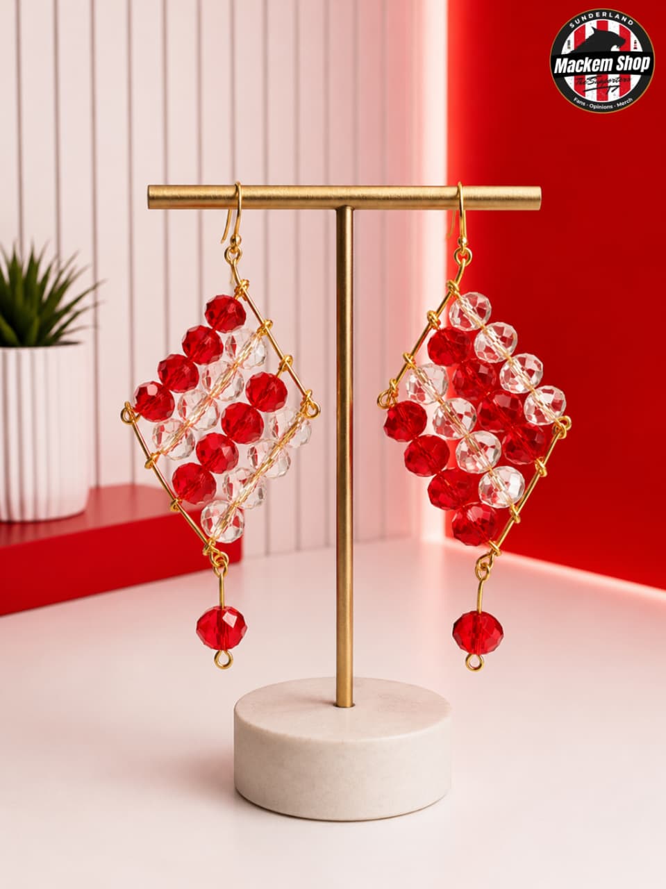 Sunderland Red & White Crystal Earrings on a earrings holder.