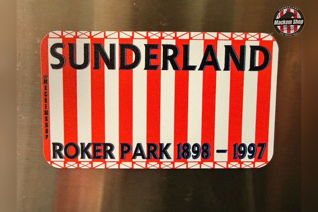 Sunderland sign with red and white stripes and text on a metallic surface