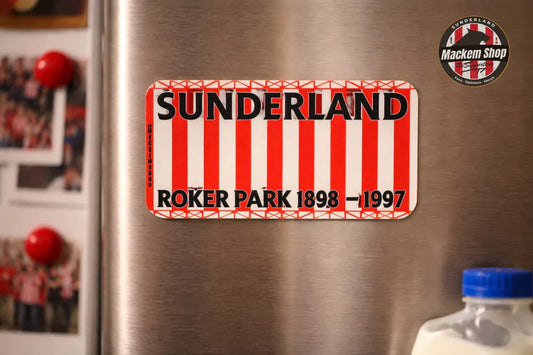 Sunderland fridge magnet on a metallic surface with a bottle and photos in the background