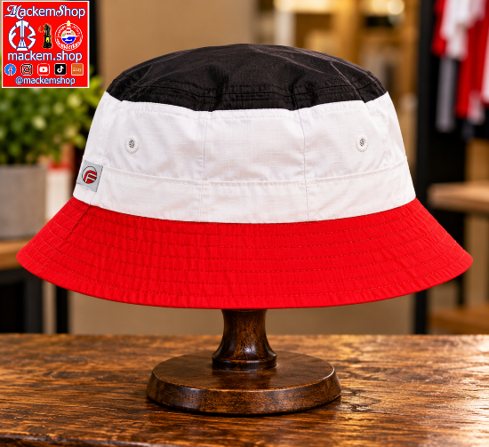 A three-color bucket hat with a black top, white middle, and red brim, displayed on a wooden stand. A red and white 'mackemshop' logo overlay is in the top-left corner.