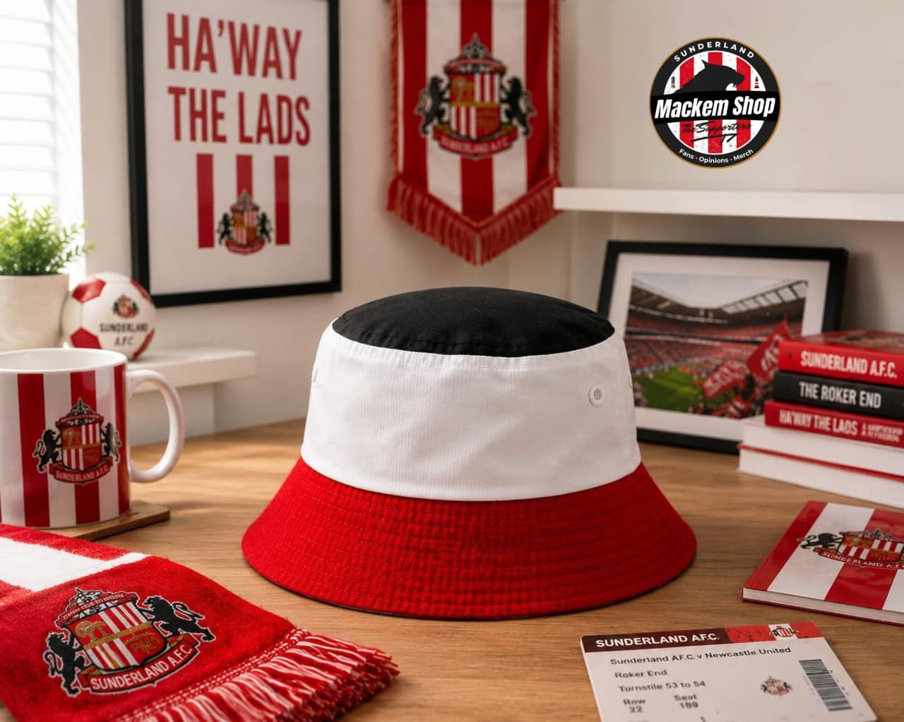 Sunderland Tricolour bucket hat on a desk with sports-themed decor