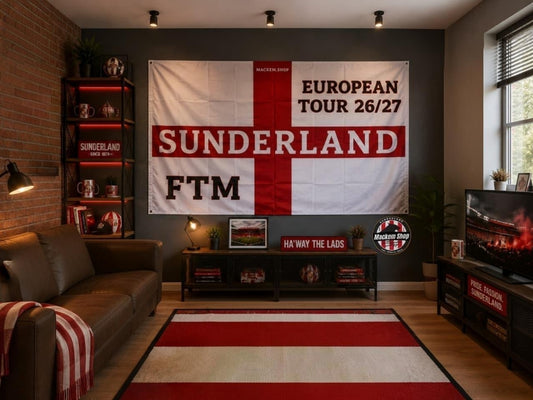 A large Sunderland FTM European Tour 26/27 flag hangs on a dark gray wall in a modern living room setting with a leather sofa, brick wall, and TV.