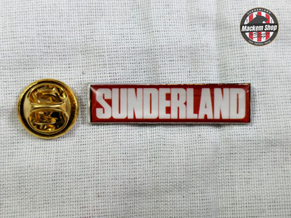 Sunderland badge with gold emblem on a textured white background