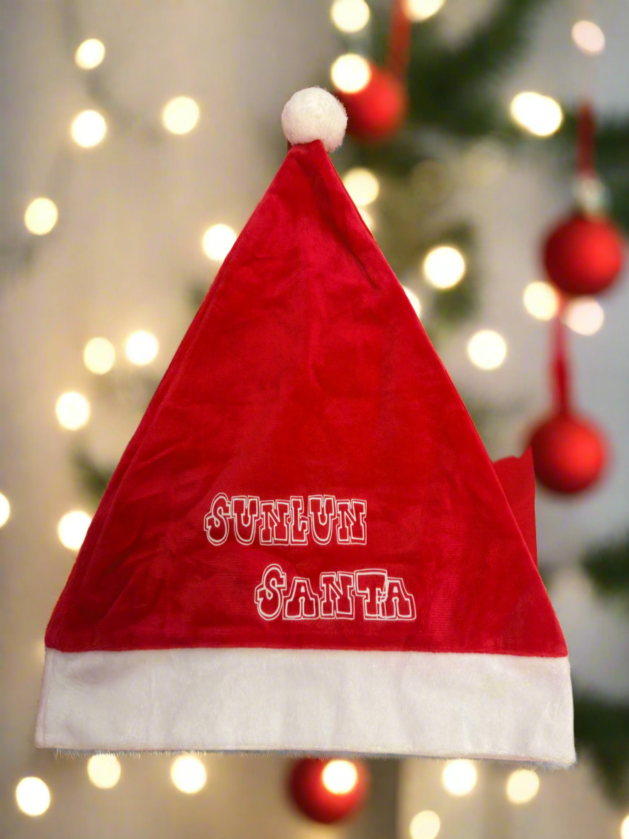 Red Santa hat with 'Sunlun Santa' text against a festive background with lights and ornaments.