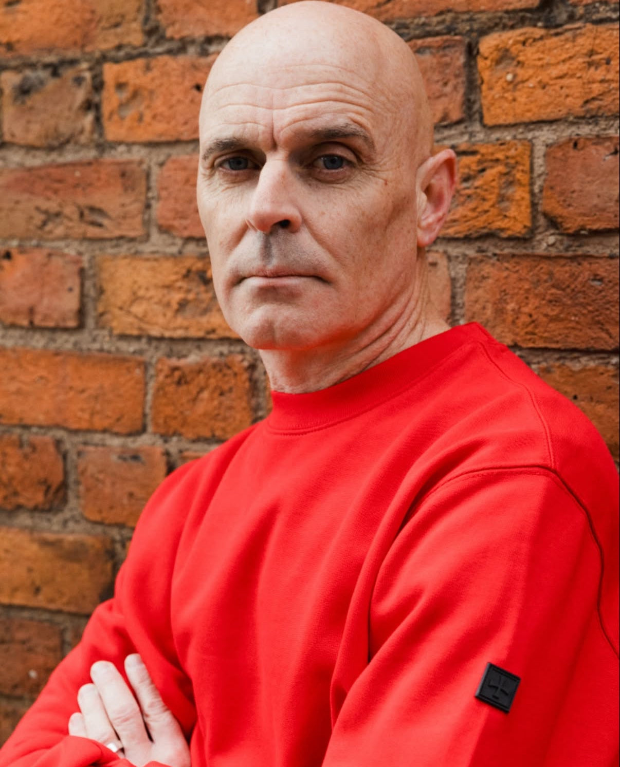 Man wearing a Terrace Cult red sweatshirt by Mackem Shop.