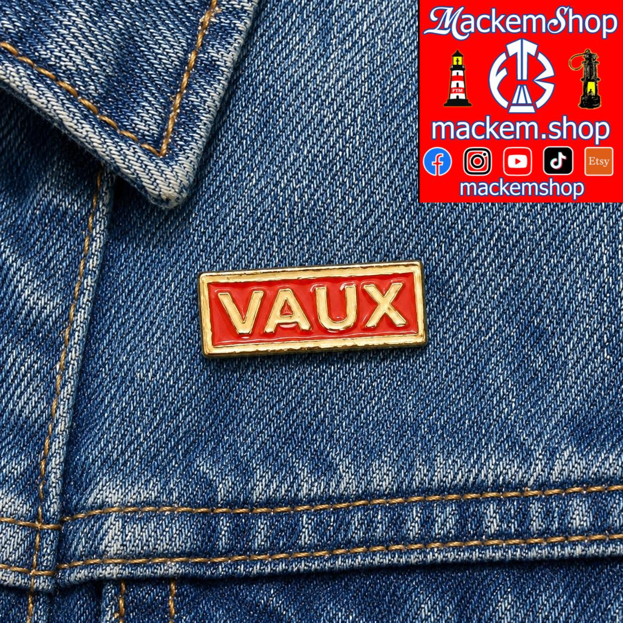 Red 'VAUX' pin on blue denim fabric with Mackem Shop branding.