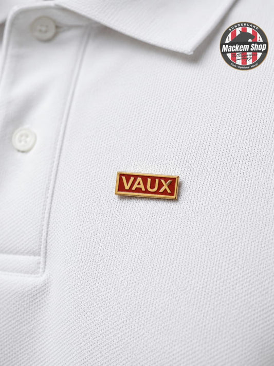 White polo shirt with a 'VAUX' badge and Mackem Shop branding.