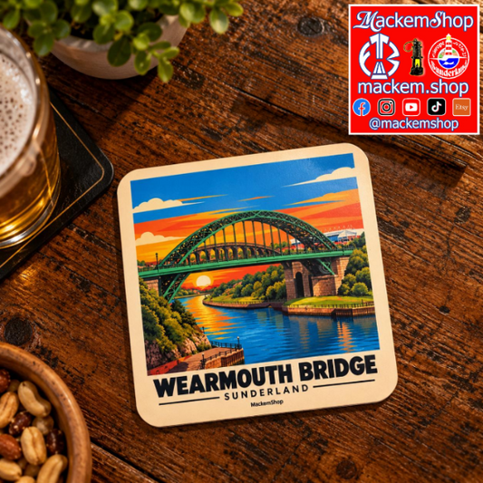 A square coaster featuring a colorful illustration of Wearmouth Bridge in Sunderland, placed on a rustic wooden table next to a glass of beer and snacks. A 'MackemShop' logo overlay is in the top right corner.