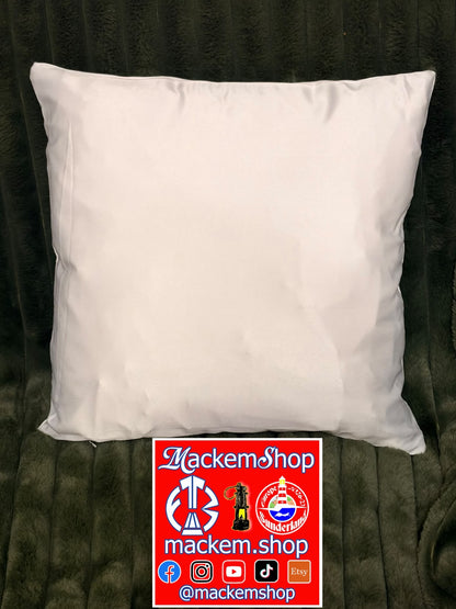 A plain white rectangular pillow or cushion cover photographed from above on a dark textured fabric surface, with a red MackemShop logo overlay at the bottom.
