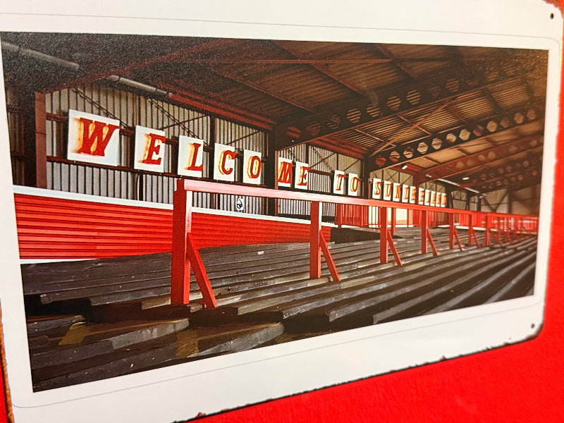 Vintage-style photo of a building interior with a 'Welcome' sign.