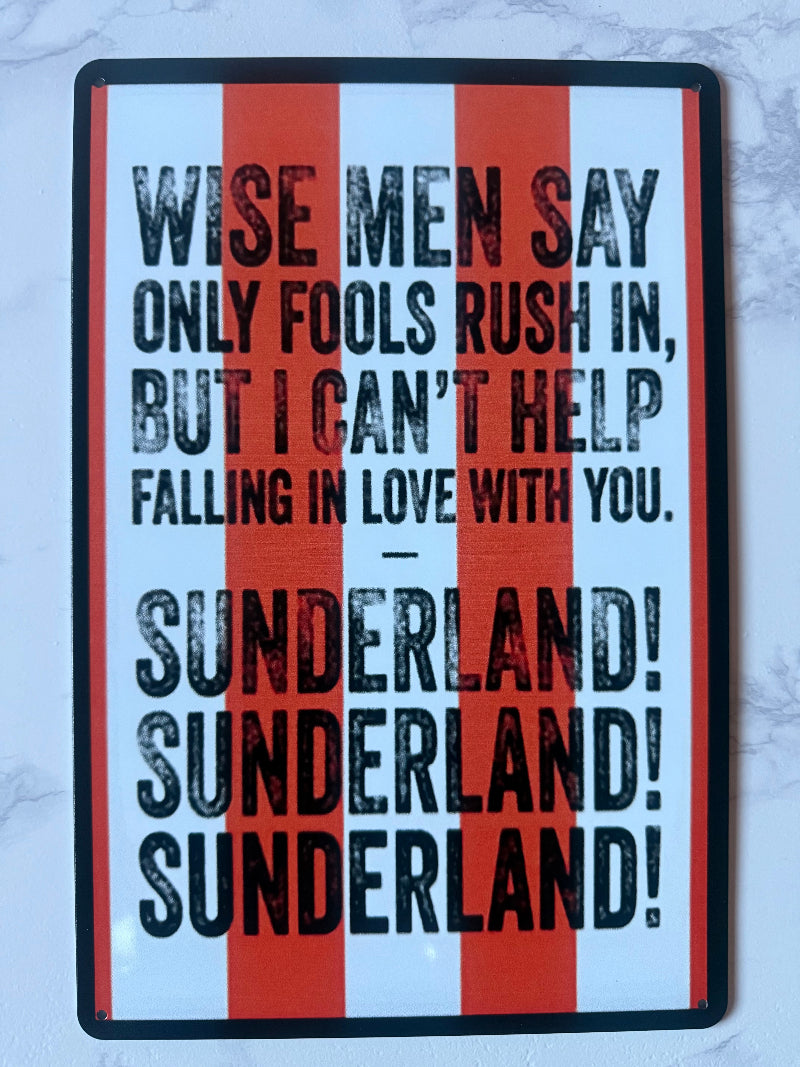 Slogan with text 'Wise men say only fools rush in, but I can't help falling in love with you. Sunderland! Sunderland! Sunderland!' on a striped background.