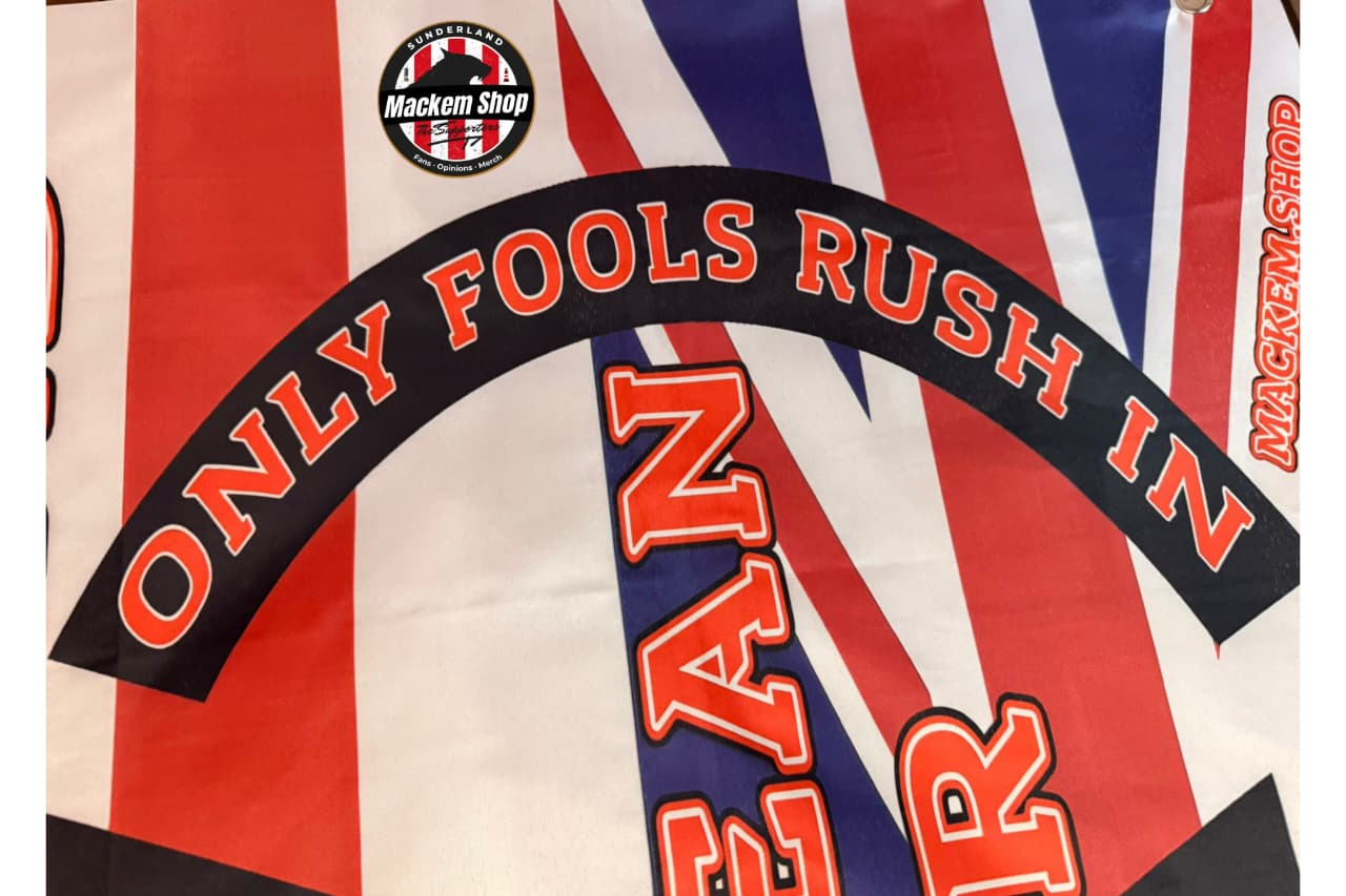 Flag with 'Only Fools Rush In' text and Mackem Shop logo