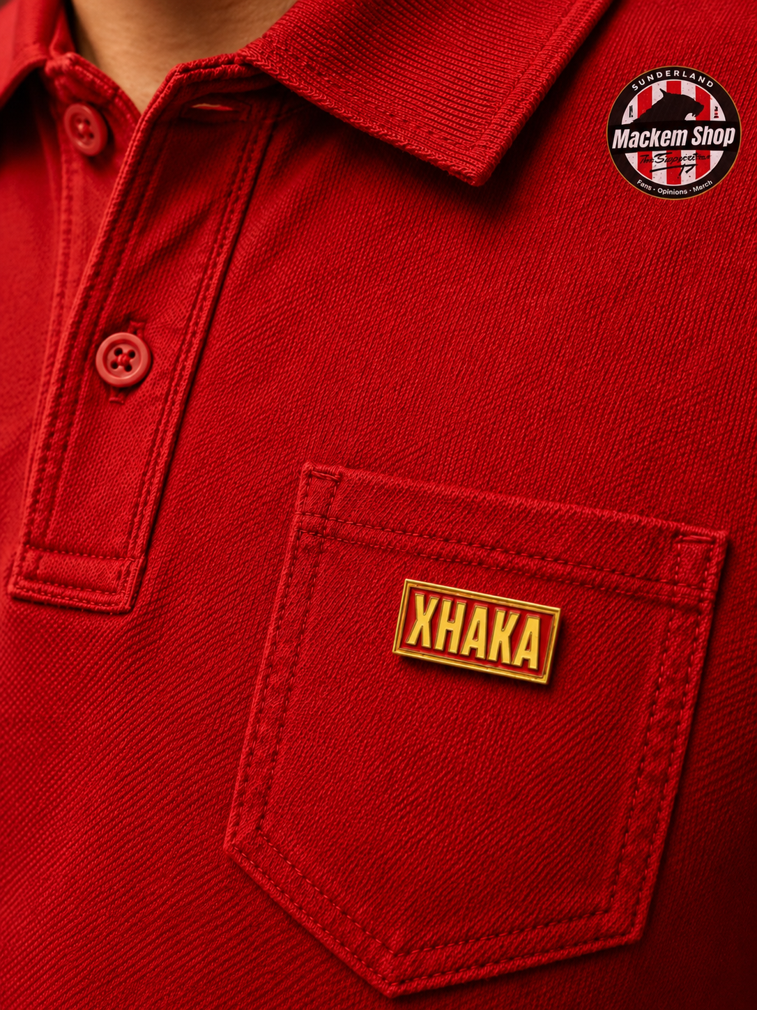 Red polo shirt with 'Xhaka' Badge on pocket and 'Mackem Shop'.
