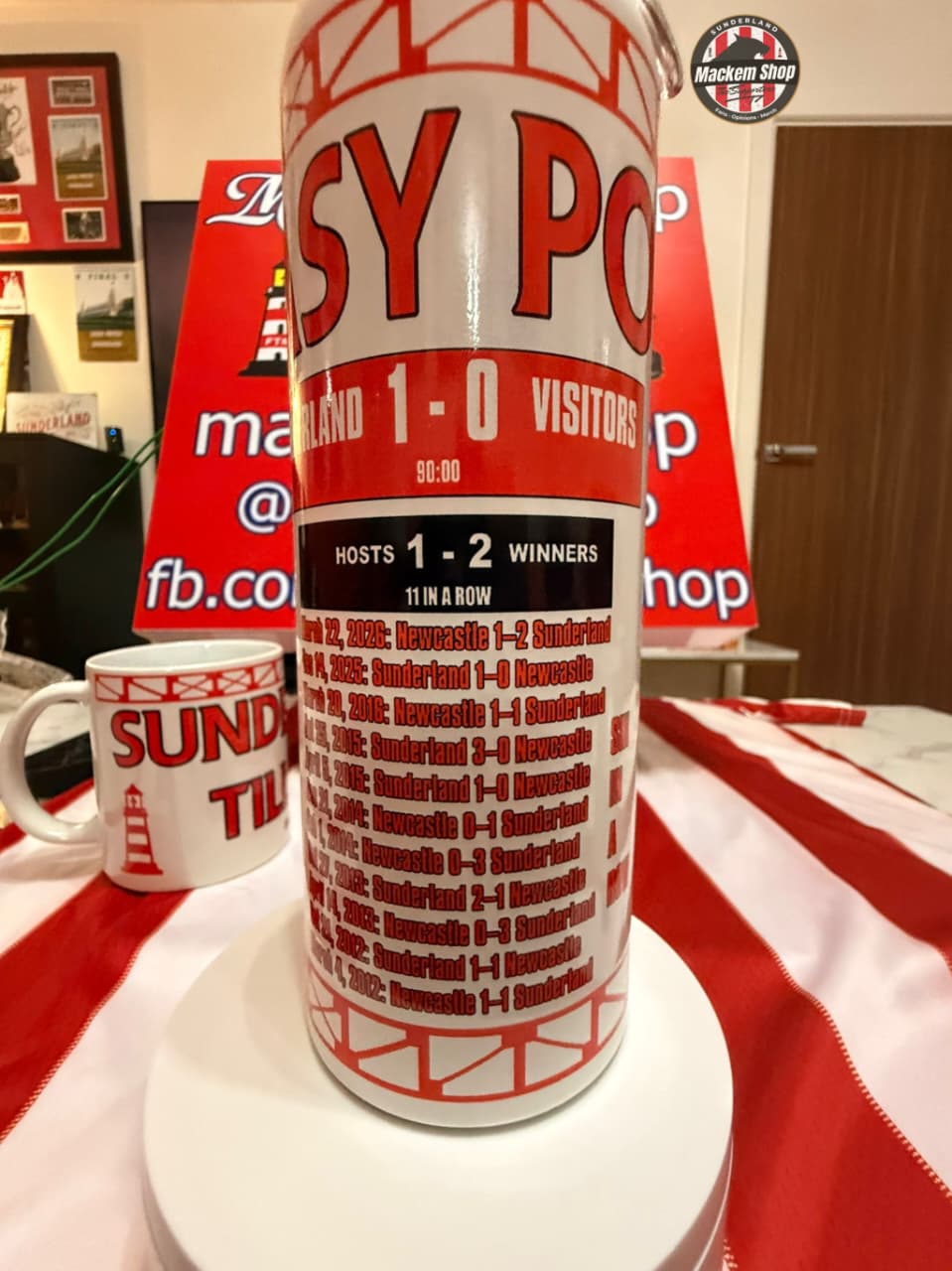 Large sports-themed water bottle with text and graphics on a table