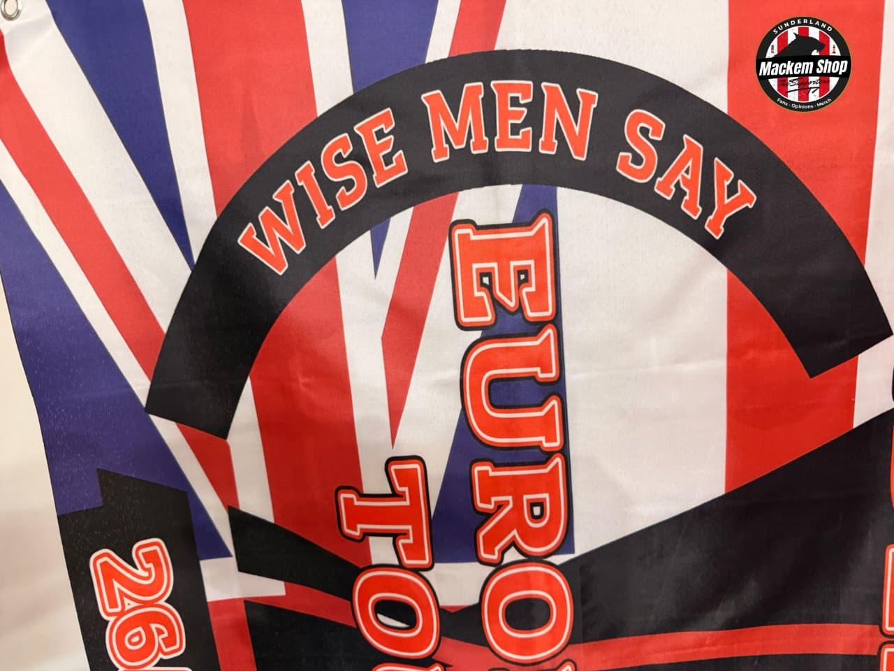 Textured fabric with 'WISE MEN SAY EURO' design on a Union Jack background